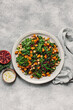 © Marta Mauri/Stocksy - Top-down view of a nutritious winter kale salad with dressing