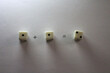 © Jakobs Studio - An addition math problem shows white dice — displaying numbers via their dots — on a white background, casting shadows. one plus one equals two