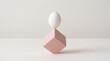 © WellnessCaptures - Egg balancing on a pink cube, showcasing delicate equilibrium and stability.