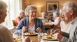 © FryArt - Happy elderly people eating a meal together in a dining room