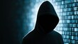 © Generative AI - Mysterious hooded figure standing in front of glowing binary code background representing cybersecurity and hacking