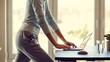 © PAVEL - Person multitasking, staying active and focused while working remotely on a laptop at a treadmill desk, blending fitness into a productive home office routine
