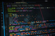 © Narong - Colorful source code on dark computer screen represents programming, software development, web coding, developer workflow, debugging, application design and modern digital technology.
