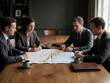 © SR07XC3 - Business professionals analyzing a map during a meeting