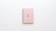 © rodrigotheras - Pink notebook with breast cancer awareness ribbon on a white background