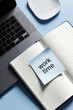 © miss irine - Laptop and open notebook with blue sticky note saying work time. Desktop setup with minimalist aesthetic. Focused planning and task management for business.