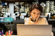 © DC Studio - Female employee focuses on a business strategy puzzle or dilemma, imagining creative concepts and projecting future outcomes while seeking a new perspective for planning and decisions.
