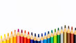 © Ayaoic - Colorful colored pencils arranged along a white background