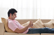 © IndiaPix - Handsome young man relaxing while listening to music