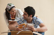 © IndiaPix - Young woman giving cupcake to man at home