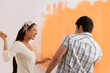 © IndiaPix - Playful young couple having fun together while painting their house