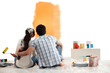 © IndiaPix - Loving young couple looking at sample paint together on wall