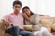 © IndiaPix - Couple getting emotional while watching movie at home