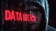© abdulqayyom - Mysterious hooded hacker silhouette posing in front of bright red glowing digital data breach warning text