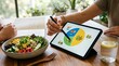 © White Craft  - Woman using tablet for personalized nutrition plan and healthy meal tracking consultation session