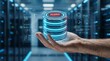 © Nest - Hand holding glowing data server stack hologram with alert notification for server maintenance and monitoring