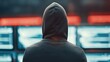 © Nart - A hooded hacker sits at a multi-monitor workstation in neon-lit darkness. Scrolling code and a cybercrime atmosphere evoke secrecy and digital intrigue.