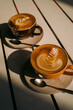 © Axel - Two cappucino coffees with latte art