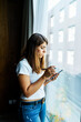 © Metadancer - A woman uses a digital pen on a tablet indoors