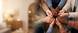 © AnaKonda.ai - Diverse group of hands coming together in a circle on a table