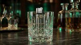 Crystal glass with metal object inside for drink preparation