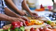 © red_orange_stock - Cooking with friends in a kitchen while preparing fresh vegetables for a meal