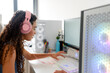 © ADDICTIVE STOCK - Young woman play computer game at desktop setup