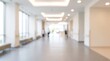 © Btc - Blurred abstract background of hospital interior hallway corridor with people walking