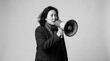 © ALI - Serious Asian Woman Speaking Through Megaphone in Black and White Portrait