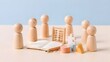 © Ribas_ProductPro - Wooden peg dolls with abacus and blank notebook representing team building education and human resources training concept