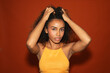 © Gonzalo Infiesta - Young black woman posing with curly hair