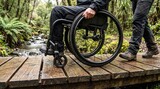 Wheelchair wheels cross an accessible timber route