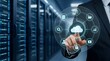 © emwe studio - IT administrator pressing a glowing cloud computing icon on a futuristic holographic interface inside a modern server room