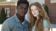 © Kristina - Couple Pose for Portrait In Front of School Building on Sunny Day