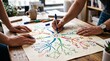 © Ednardo - Brainstorming Session: Two individuals collaborating on a mind map, sharing ideas and strategies to foster creativity and innovation.