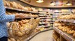 © Emma - Customer shopping for fresh bakery bread in supermarket aisle, holding wire basket with baguette and rolls, grocery store interior, food retail, healthy eating and daily nutrition