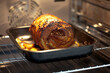 © Westend61 - A rolled roast pork bakes inside an electric oven