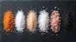 © Pinit - A spectrum of mineral seasoning options featuring orange, white, pink, and black coarse salts.