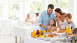 © D-stock photo - Family choosing breakfast at hotel buffet as family vacation and travel with children concept