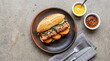 © Sev - Peruvian Pan con Chicharrón on Neutral Stone Surface, Top View Minimal Food Photography