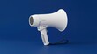 © Marjana - White megaphone isolated on vibrant blue background for powerful messaging and announcements