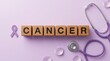 © Stocker Man - Cancer awareness concept with purple ribbon and stethoscope