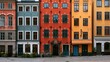 © Hasan - Colorful historic buildings with bright facades line a cobblestone street in Stockholm. This picturesque European cityscape represents travel, architecture, and urban lifestyle.