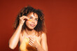 © Gonzalo Infiesta - Young woman applying under eye patches for skin care
