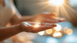© Laura - close-up of hands with light energy healing at a bright luxury spa, face out of frame, reiki peace concept, zen meditation therapy, spiritual wellness, bright, with copy space
