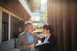 © Davor - Business colleagues having a serious conversation outside the office