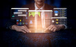 © InfiniteFlow - Professional man using digital devices to access online education platforms with various interactive screens and data analytics in a modern workspace Haptic.