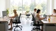 © SimpleDesignStudio - Young adult women and men working together in a bright modern open space startup office