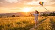 © Oleg - Happy caucasian girl running across meadow with colorful kite during outdoor play. Joyful child enjoying summer vacation and active games in countryside at sunset.