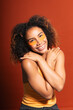 © Gonzalo Infiesta - Young woman smiling wearing eye patches doing self-care